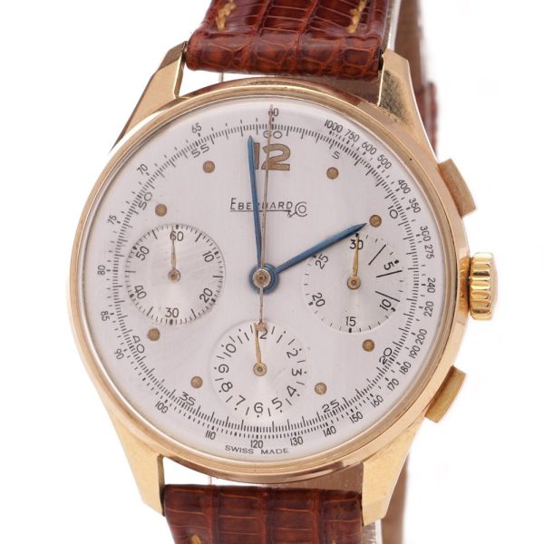 Vintage Eberhard 18ct Gold Mechanical Chronograph Watch, 35mm round gold case with white dial with three sub-dials and tachymeter scale, on brown leather strap. Circa 1950s