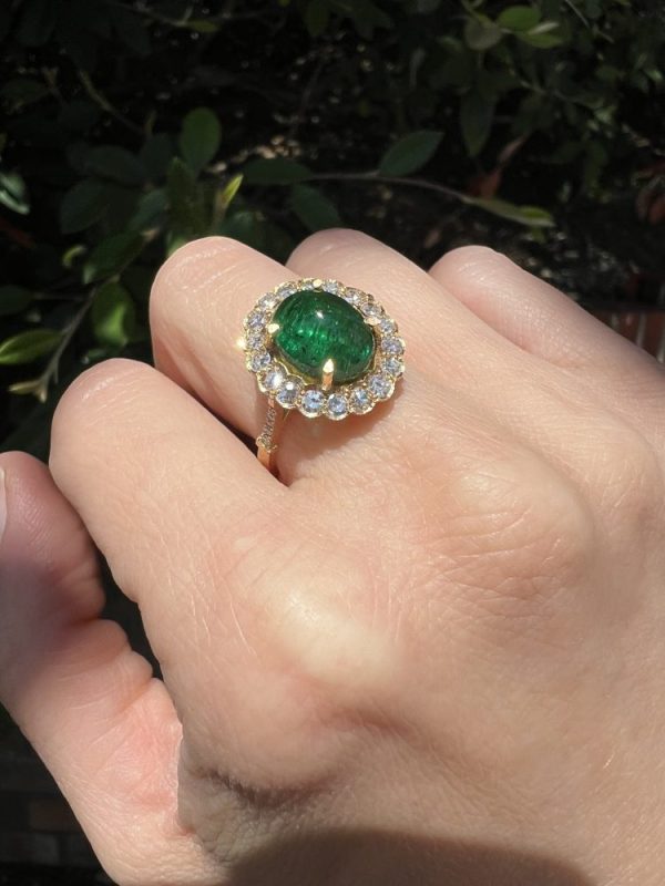 Zambian emerald and diamond cluster ring in gold.
