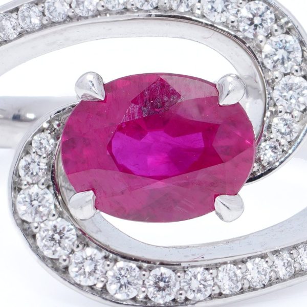 Vintage 1.20ct Ruby and Diamond Dress Ring, central 1.20ct oval red ruby surrounded by dynamic curve with pavé-set diamonds in platinum. Circa 1990s