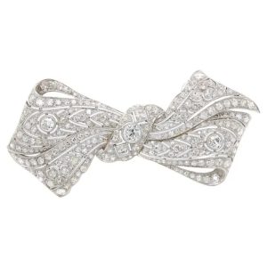 Vintage 8ct Old Cut Diamond Bow Brooch, set with 8 carats of old-cut, single-cut and square shaped diamonds in 18ct white gold with a 14ct white gold pin