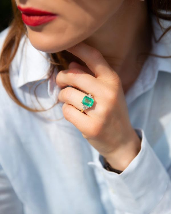 Emerald and diamond ring in gold and platinum.