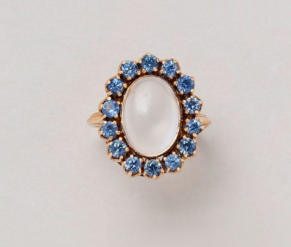 Vintage 14ct rose gold cluster ring with moonstone cabochon bezel set in prong setting surrounded by brilliant cut sapphires.