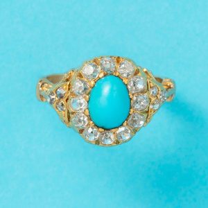 Antique 18ct yellow gold cluster ring with oval turquoise cabochon and old cut diamonds.