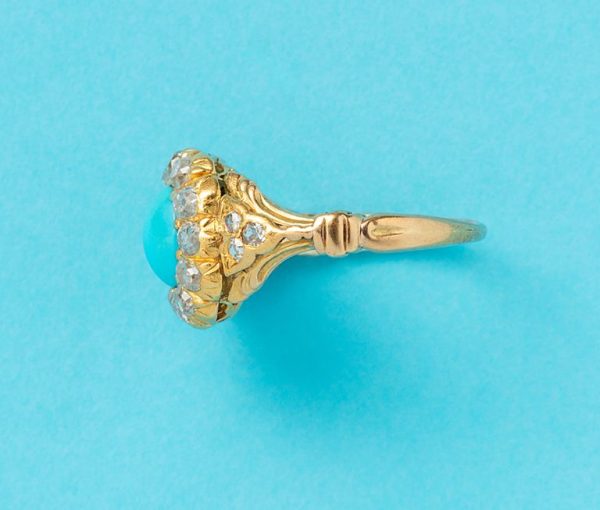 Antique 18ct yellow gold cluster ring with oval turquoise cabochon and old cut diamonds.