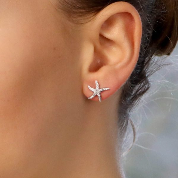 Diamond starfish stud earrings in white gold.