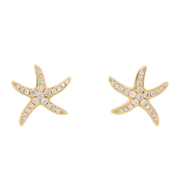 Diamond starfish earrings in yellow gold.