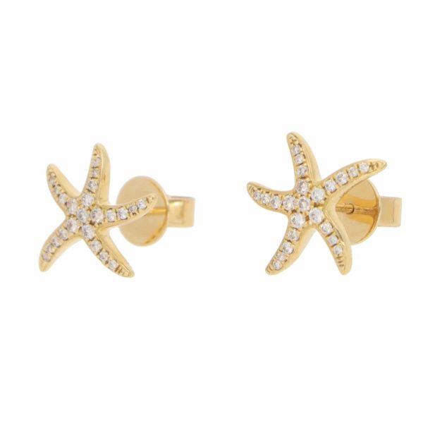 Diamond starfish earrings in yellow gold.