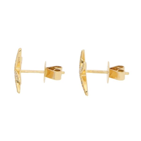 Diamond starfish earrings in yellow gold.