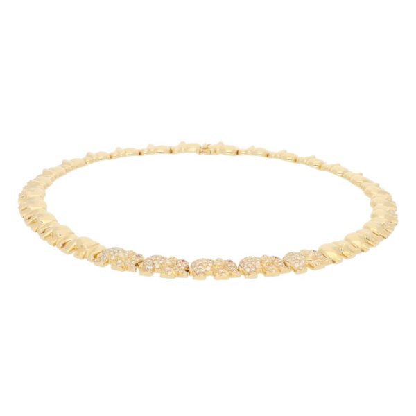 Diamond and ruby walking elephant necklace in gold.