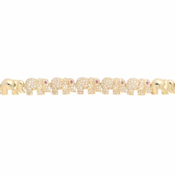 Diamond and ruby walking elephant necklace in gold.