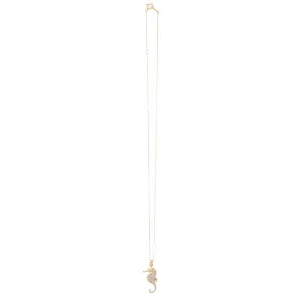 Diamond seahorse pendant necklace in gold.