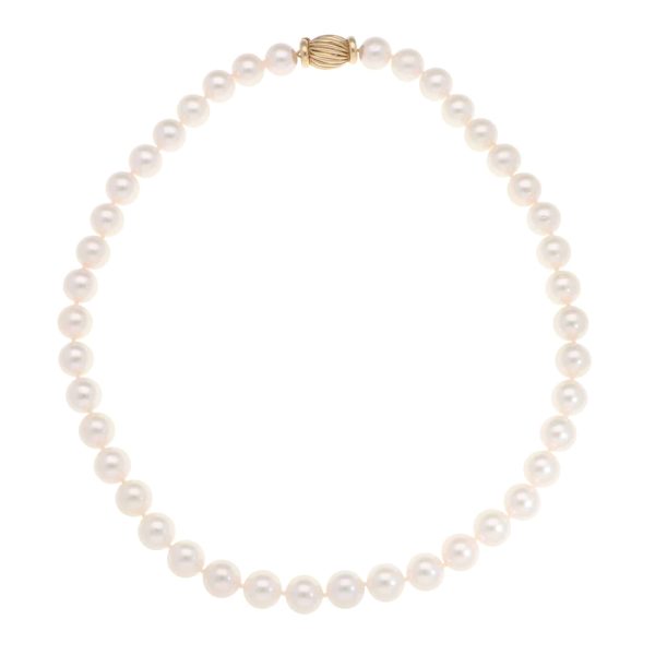 Akoya pearl necklace with a vintage ridged barrel clasp in gold.