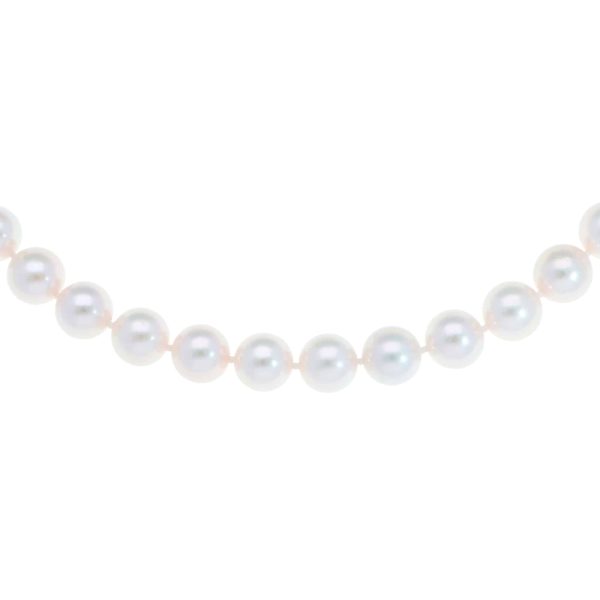 Akoya pearl necklace with a vintage ridged barrel clasp in gold.