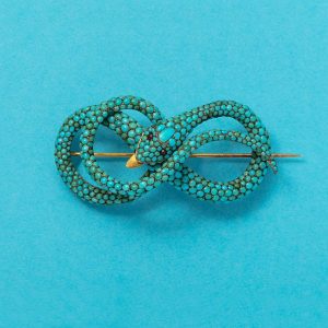 An antique Georgian gold and turquoise snake brooch