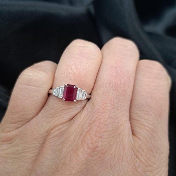 1ct Burma Ruby and Baguette Diamond Engagement Ring, 1.07ct emerald-cut Burmese ruby flanked with graduated stepped baguette-cut diamonds in platinum