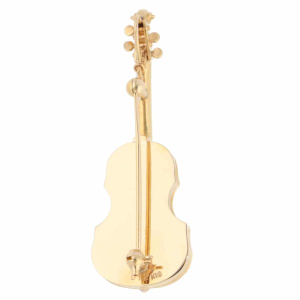 Diamond violin brooch in yellow gold.