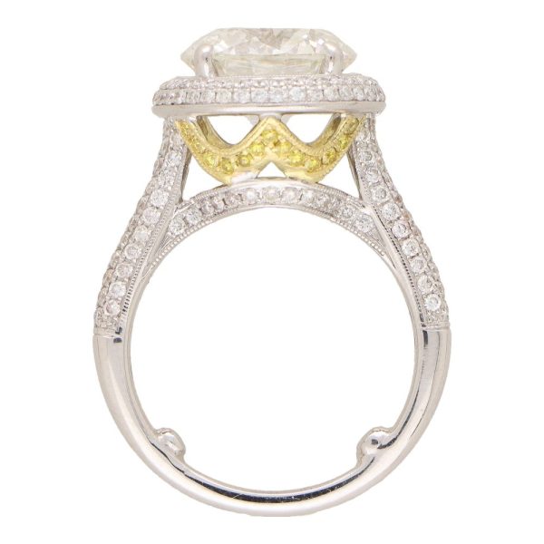 Diamond solitaire ring in platinum and yellow gold.