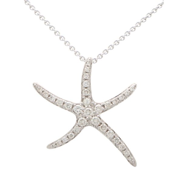 Diamond starfish pendant necklace in white gold.
