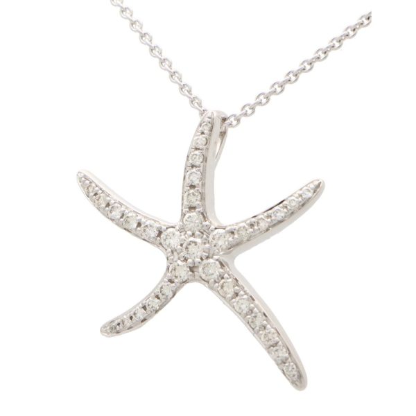 Diamond starfish pendant necklace in white gold.