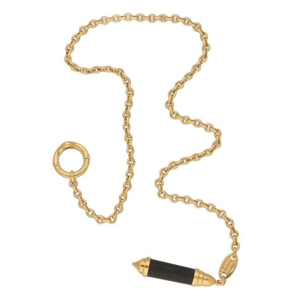 Chaumet necklace in yellow gold with snakewood pendant.