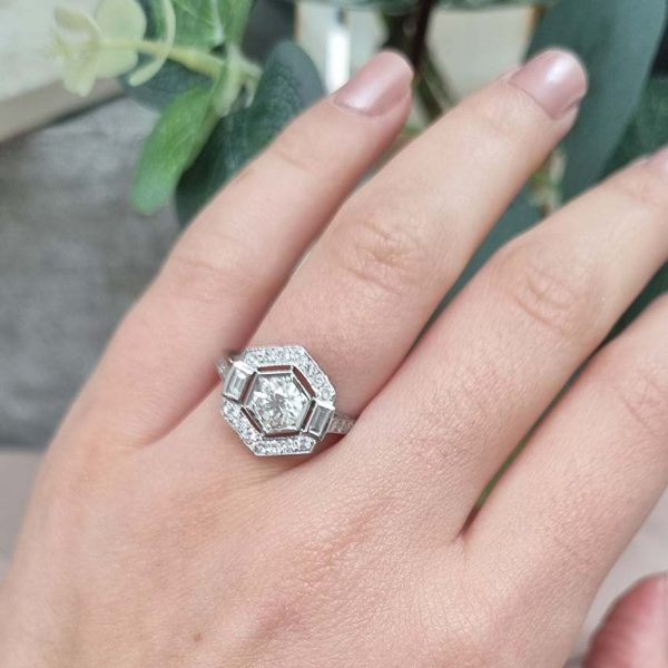 Hexagonal Diamond Cluster Engagement Ring in Platinum, 1.15 carats, 0.75ct diamond surrounded by fixed border of brilliant-cut diamonds with baguette-cut diamonds to each side