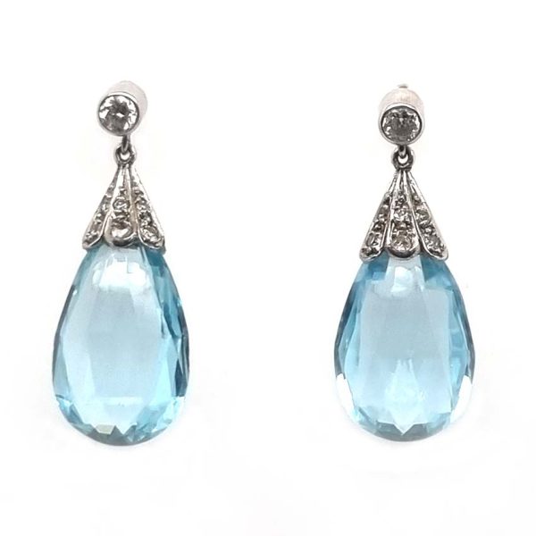 Edwardian Antique 16cts Briolette Aquamarine and Diamond Drop Earrings, Teardrop shaped briolette-cut aquamarine with rose-cut diamond set caps to single stone diamond solitaire tops in platinum. Circa 1910