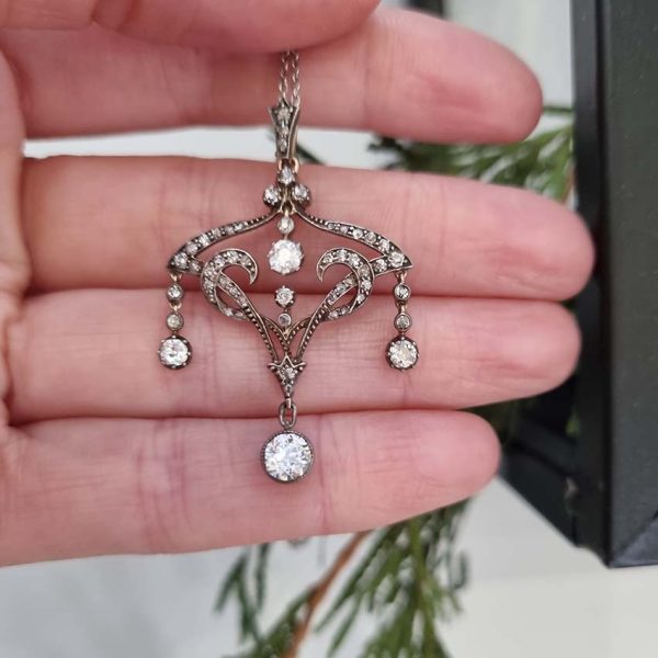 Antique Art Nouveau 1.50ct Old Cut Diamond Pendant, iconic fluid design set with 1.50 carats of old-cut diamonds with articulated drops in silver to 18ct gold