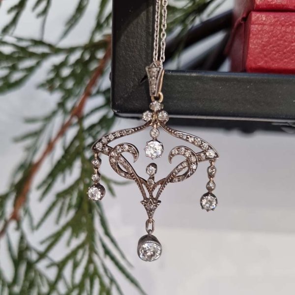 Antique Art Nouveau 1.50ct Old Cut Diamond Pendant, iconic fluid design set with 1.50 carats of old-cut diamonds with articulated drops in silver to 18ct gold