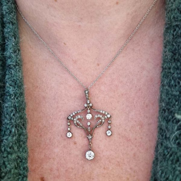 Antique Art Nouveau 1.50ct Old Cut Diamond Pendant, iconic fluid design set with 1.50 carats of old-cut diamonds with articulated drops in silver to 18ct gold