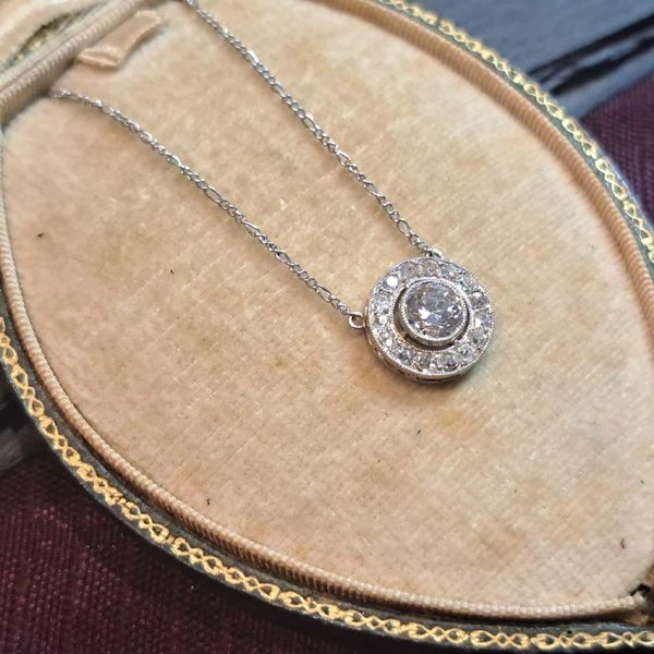 Art Deco 0.80ct Old Cut Diamond Halo Cluster Pendant in Platinum, 1.25cts, 0.80ct old European transitional-cut diamond 0.45ct old mine-cut diamond border