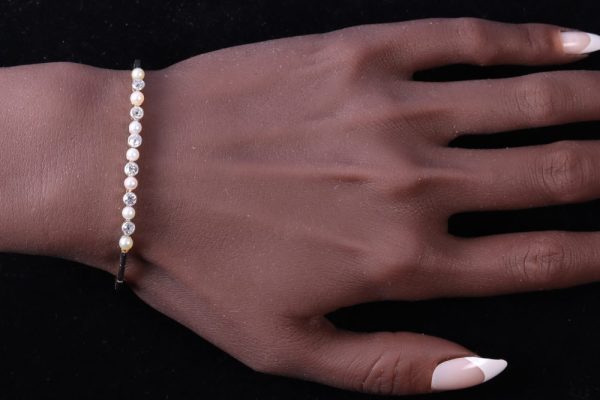 Art Deco diamond and pearl bracelet in white and yellow gold.