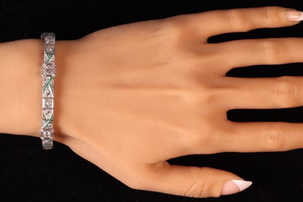 Art Deco platinum bracelet with diamonds and emeralds.