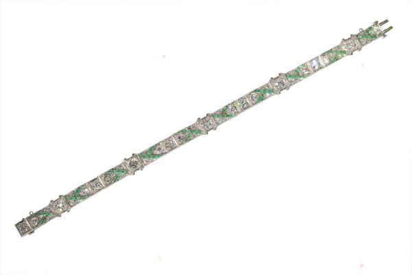 Art Deco platinum bracelet with diamonds and emeralds.