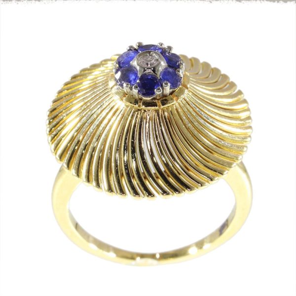 Vintage gold ring set with diamond and sapphires.