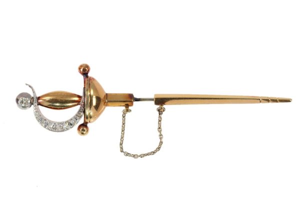 Vintage diamond sword brooch in yellow gold.