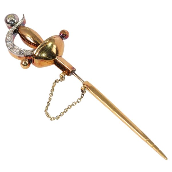 Vintage diamond sword brooch in yellow gold.