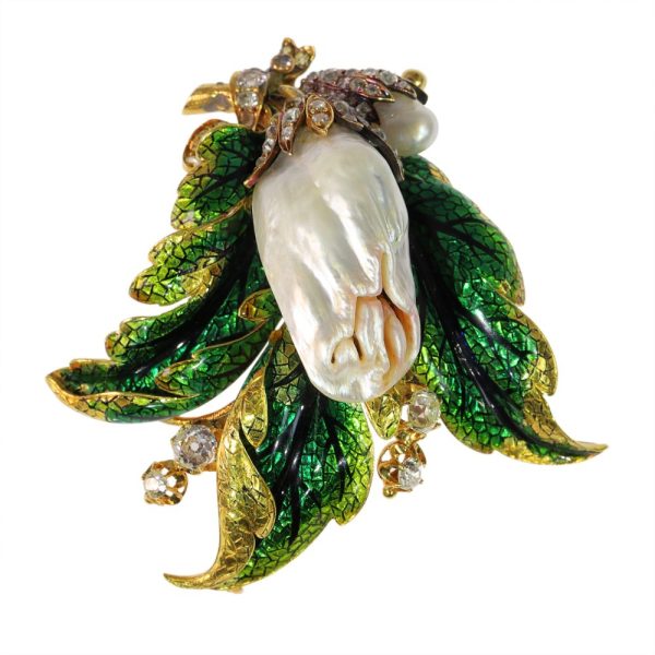 Blister pearl and diamond brooch in gold.