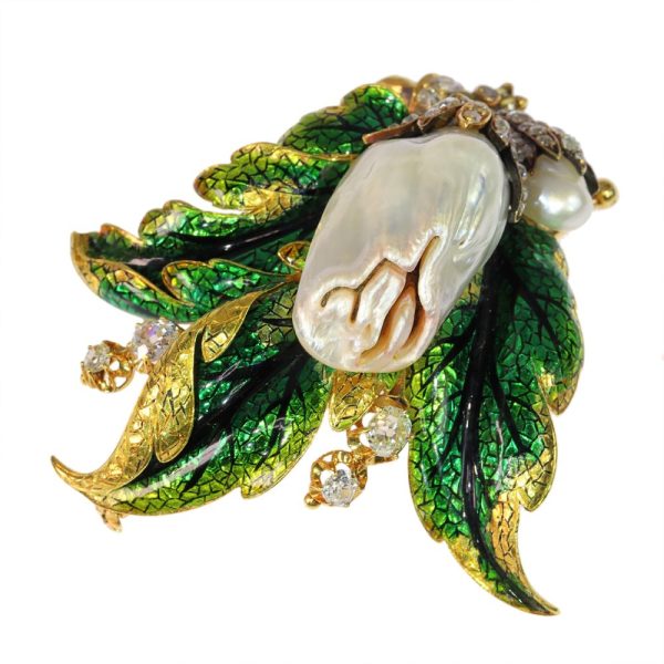 Blister pearl and diamond brooch in gold.