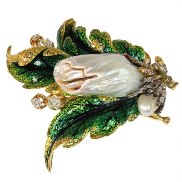 Blister pearl and diamond brooch in gold.