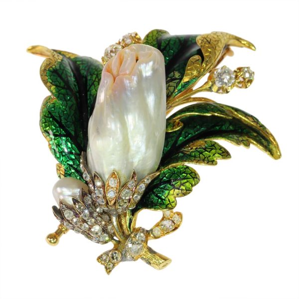 Blister pearl and diamond brooch in gold.
