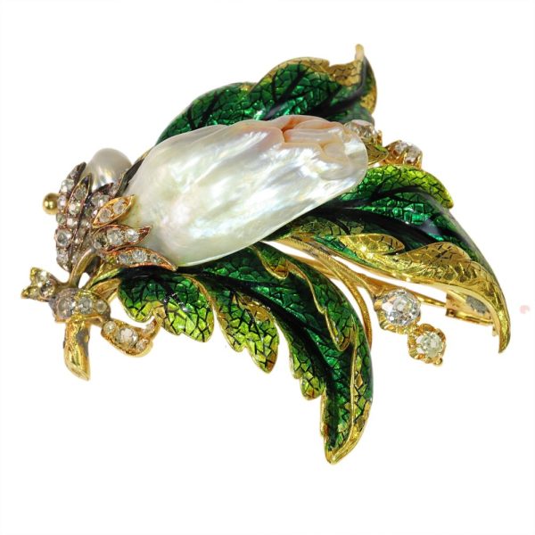 Blister pearl and diamond brooch in gold.
