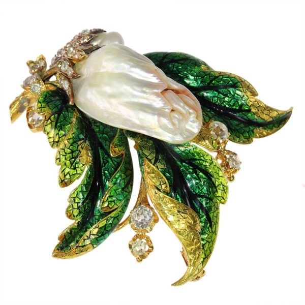 Blister pearl and diamond brooch in gold.
