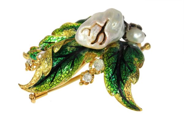 Blister pearl and diamond brooch in gold.