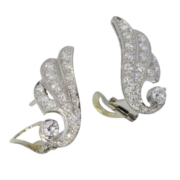 Diamond wing earrings in platinum.