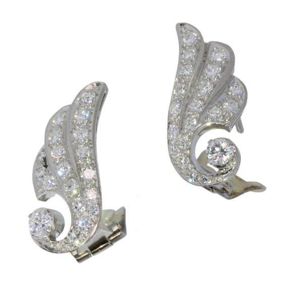 Diamond wing earrings in platinum.