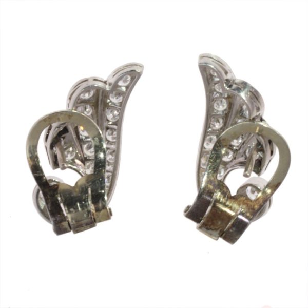 Diamond wing earrings in platinum.