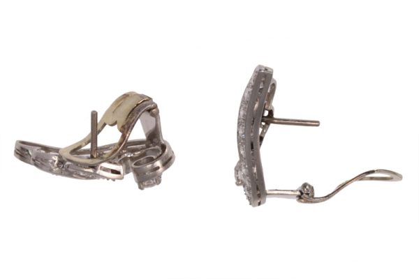 Diamond wing earrings in platinum.