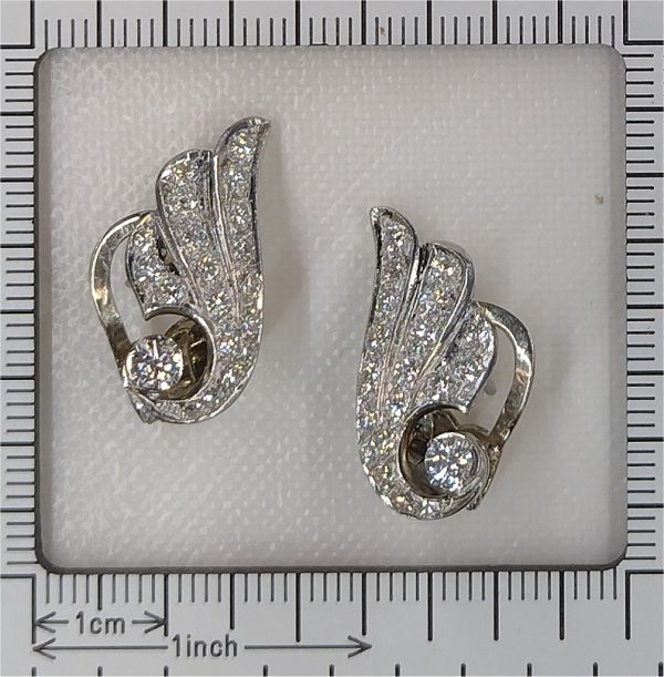 Diamond wing earrings in platinum.