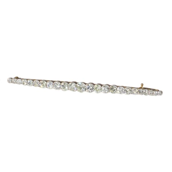 Gold and platinum bar brooch with old cut diamonds.