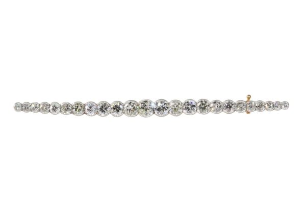Gold and platinum bar brooch with old cut diamonds.